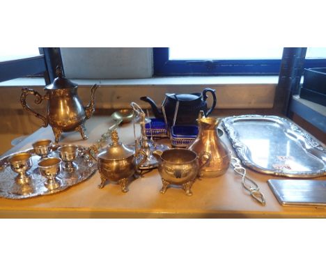 Shelf of mixed silver plated items including trays, egg cups, cigarette case etc