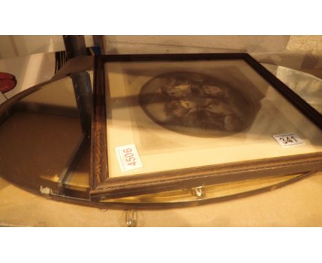 Vintage oval mirror with bevelled edges and a framed picture