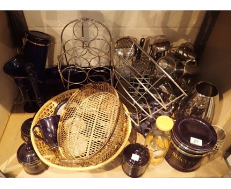 Shelf of kitchenware in blue ceramic, stainless steel and chrome