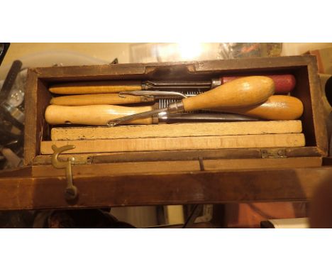 Pine box containing rug making tools
