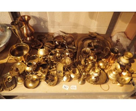 Shelf of mixed brass and copperware 