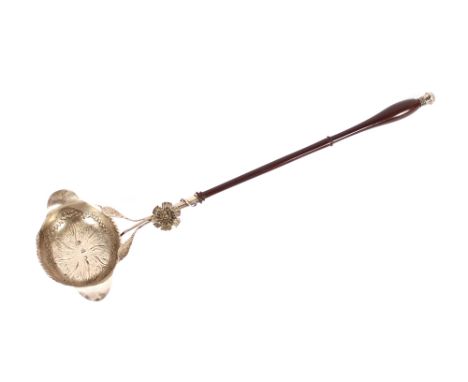 A 19th Century continental silver punch ladle,&nbsp;having foliate embossed decoration to the oval bowl, leaf surmounts and t
