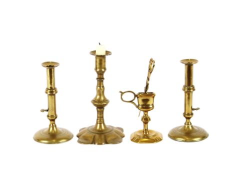 A pair of antique brass slide action candlesticks,&nbsp;raised on circular bases 17cm high; an antique brass chamber stick wi