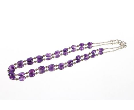 A silver and amethyst set necklace