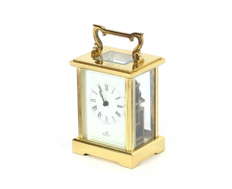 A brass cased carriage clock, with white enamel dial, signed Imperial, platform escapement, 13 jewel movement, hours striking