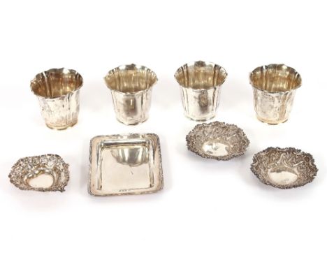 A set of four silver beakers, A &amp; J Zimmerman, Birmingham 1914, fluted and flared, 7ozs, 7cm; a rectangular card stand,&n