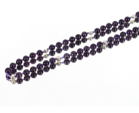 A large silver and amethyst necklace