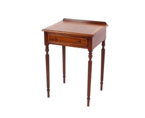 A pair of walnut and cross-banded single drawer lamp tables, raised on reeded tapering supports, 54cm wide