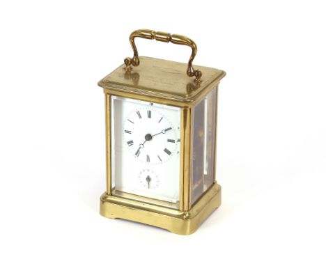 A large brass cased carriage clock, with alarm movement, striking on a bell, 16cm overall