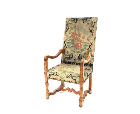A pair of 18th Century continental high back armchairs,&nbsp;the seats and backs upholstered in original needlepoint tapestry