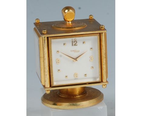 An Imhof gilt brass four-sided desk compendium, housing clock, hygrometer, therometer and thermometer, each with hinged actio