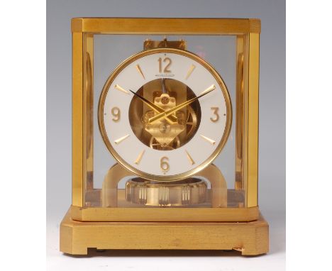 A Jaeger le Coultre lacquered brass Atmos clock, having a white dial stamped Jaeger le Coultre Atmos Swiss Made, within glaze