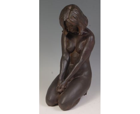 Walter Awlson (b.1949) - A Raku ceramic figure of a kneeling female nude with clasped hands, incised Awlson 60/75 verso, h.50