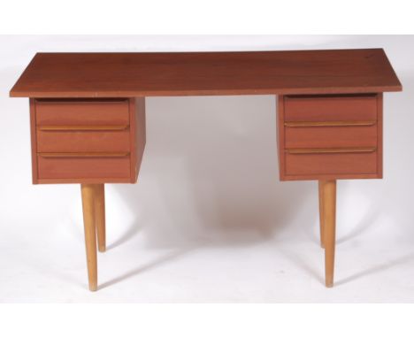A 1960s Danish teak kneehole desk, each upper pedestal with three drawers, on further turned tapering supports, h.69cm, w.120
