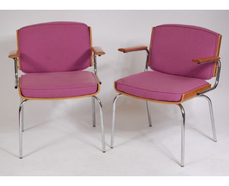 A pair of 1960s Danish tubular chrome and plywood desk elbow chairs, each having purple upholstered fixed padback and seats, 