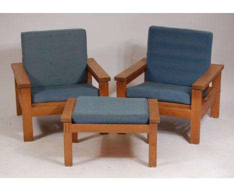 A pair of 1960s Danish light oak framed open armchairs, each with hinged and laddered adjustable seats, blue upholstered cush