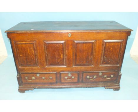 A George III mahogany-banded oak panel mule chest, the lift lid above a panel and three drawers, within Corinthian quarter co