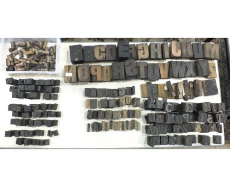 A collection of mid-20th century wooden printing blocks, various print sizes and fonts.