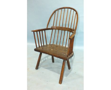 A late 18th/early 19th century ash and elm primitive stick-back chair with comb back and solid seat on four simple turned spl