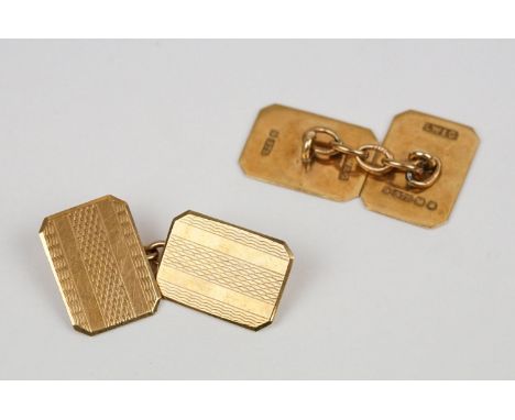 Pair of 9ct yellow gold chain-link cufflinks, the elongated octagonal panels with engine turned decoration, length of panel a