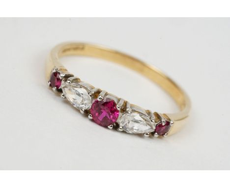 Ruby and cubic zirconia 15ct yellow gold and white gold set ring, three graduated small round mixed cut rubies, two pear-shap