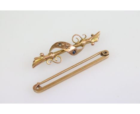 9ct yellow tie brooch together with a sapphire and 9ct yellow gold bar brooch (two stones missing) (2) 
