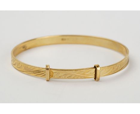 Childs' 9ct yellow gold christening bangle, engraved foliate scroll decoration, width approx 4mm 