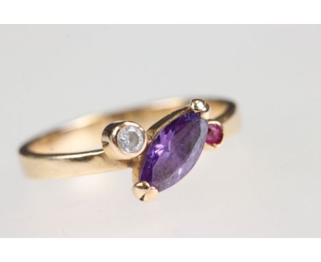 Amethyst, ruby and diamond 14ct yellow gold ring, the marquise cut amethyst measuring approx 7mm x 4mm, claw and collet set, 