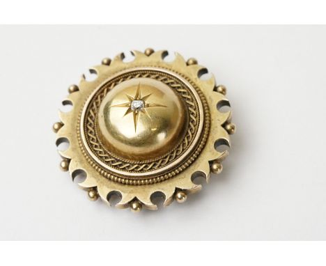 Late 19th century diamond 15ct yellow gold target brooch, small round cushion cut diamond to centre weighing approx 0.07 cara
