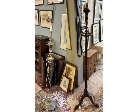 Ornate brass standard lamp together with a wooden standard lamp 