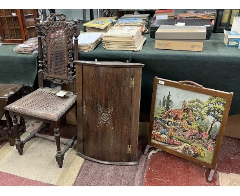 Carved bergère chair together with corner cupboard and fire screen 