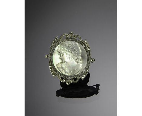 Cameo is Mother of Pearl, setting is marked and tested sterling silver. Total weight: 14.2 grams (.46 troy).  Dimensions are: