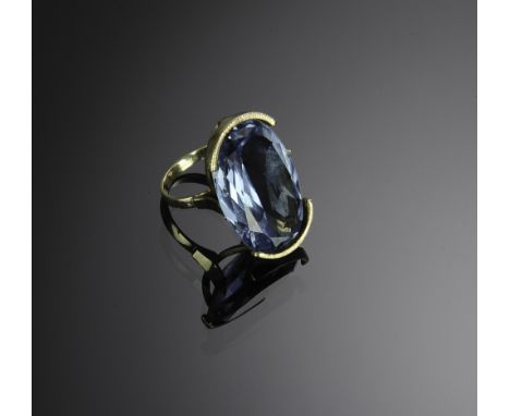 Marked and tested 14K ring with an approximately 39.12 carat oval cut Blue Topaz. Total weight: 14 grams (.45 troy).  Dimensi