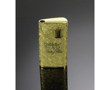 Unused gold tone Ronson 15V lighter, engraved: Gratefully Rudy Vallee.  Dimensions are: 2 1/2" tall, 1 7/16" long. All measur