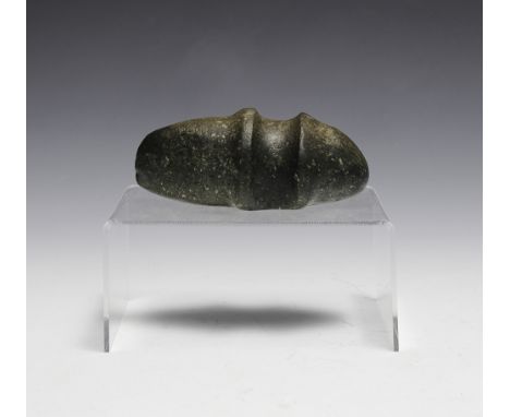 Small stone axe head made by the Yokuts tribe who reside in California.  Dimensions are: 4 1/2" long, 2 3/8" wide. All measur