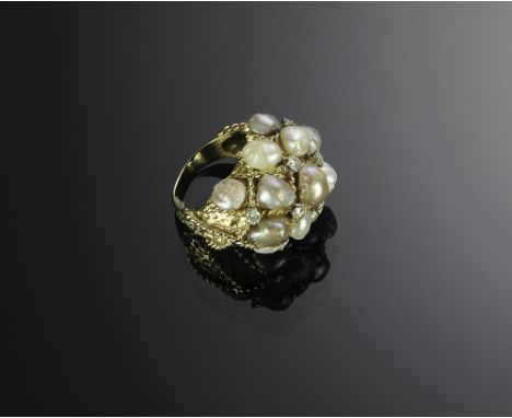 Marked and tested 14K with eight diamonds approximately 2.8 mm diamonds and 13 pearls of alternating white and grey. Total we