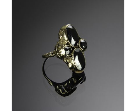 Tested 14K with four bezel set hematite stones. Oval are 11mm X 13mm and round are 6mm. Total weight: 9.5 grams (.30 troy).  