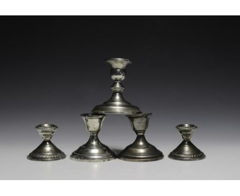 Includes two matching pairs and one lone candlestick. The smallest pair are marked with the hallmark for DS Spaulding Co. The
