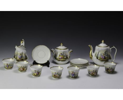 Very colorful transfer ware with gilt trim. Includes teapot, sugar, creamer, seven cups, and four saucers.  Dimensions are: L