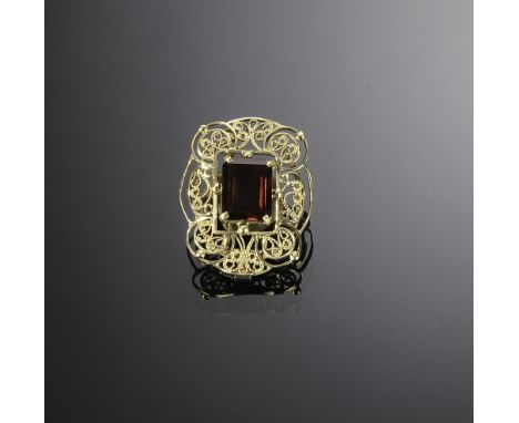 Circa 1940 with trombone clasp. Tested 14K with a synthetic rectangular ruby of approximately 11ctw. Total weight: 13.8 grams