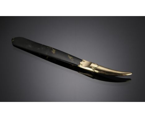 A tortoise shell letter opener with a gold, pointed handle. The gold handle is marked "A. Barrett & Sons 63 & 64 Piccadilly."