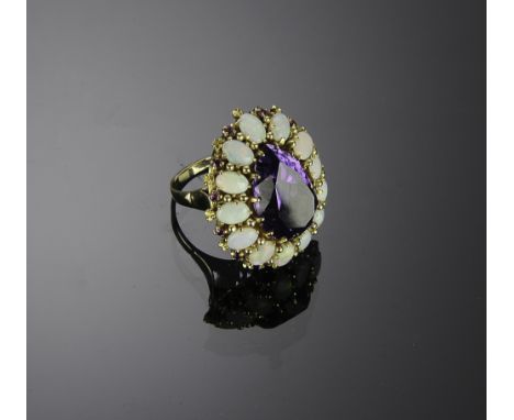 Marked and tested 14K with a pear cut Amethyst of approximately 9 ctw, 12 cabochon natural Opals approximately 9ctw and 13 ap