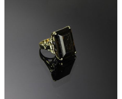 Unmarked tested 14K gold with an emerald cut 45 ctw Smokey Topaz. Total weight: 17.5 grams (.56 troy).  Dimensions are: 15/16