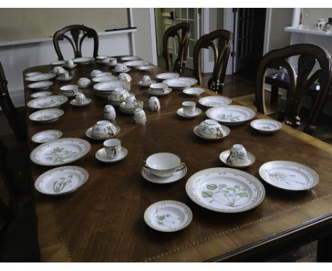 12 complete places settings of seven pieces: dinner plate, salad plate, bread & butter plate, soup bowl, soup plate, a teacup