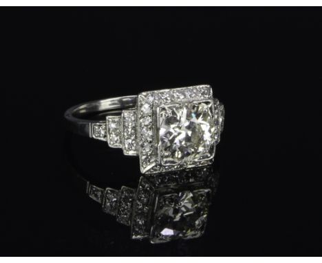 Art Deco platinum ring with a center 1.2 carat European cut diamond of VS clarity and J-K color with 32 round cut diamonds to