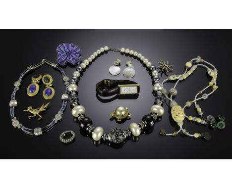 Thirteen pieces of assorted costume jewelry. Lot includes three necklaces, three sets of earrings, four pins, one ring, and a