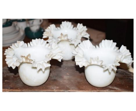 Three opaque glass lamp shades of frilled design  