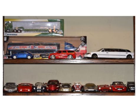 Group of thirteen 1:18 scale die-cast model cars comprising: Motor Max Chrysler, Maisto McLaren Mattel Ferrari 250 Testarossa