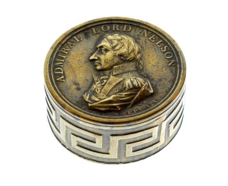 Early 19th Century circular brass box with portrait of Admiral Lord Nelson, Greek key border and legend beneath 'Conqueror at