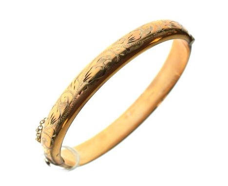 9ct gold engraved snap bangle having steel core  